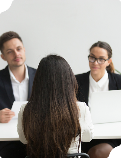 A job interview scene with a candidate facing two interviewers